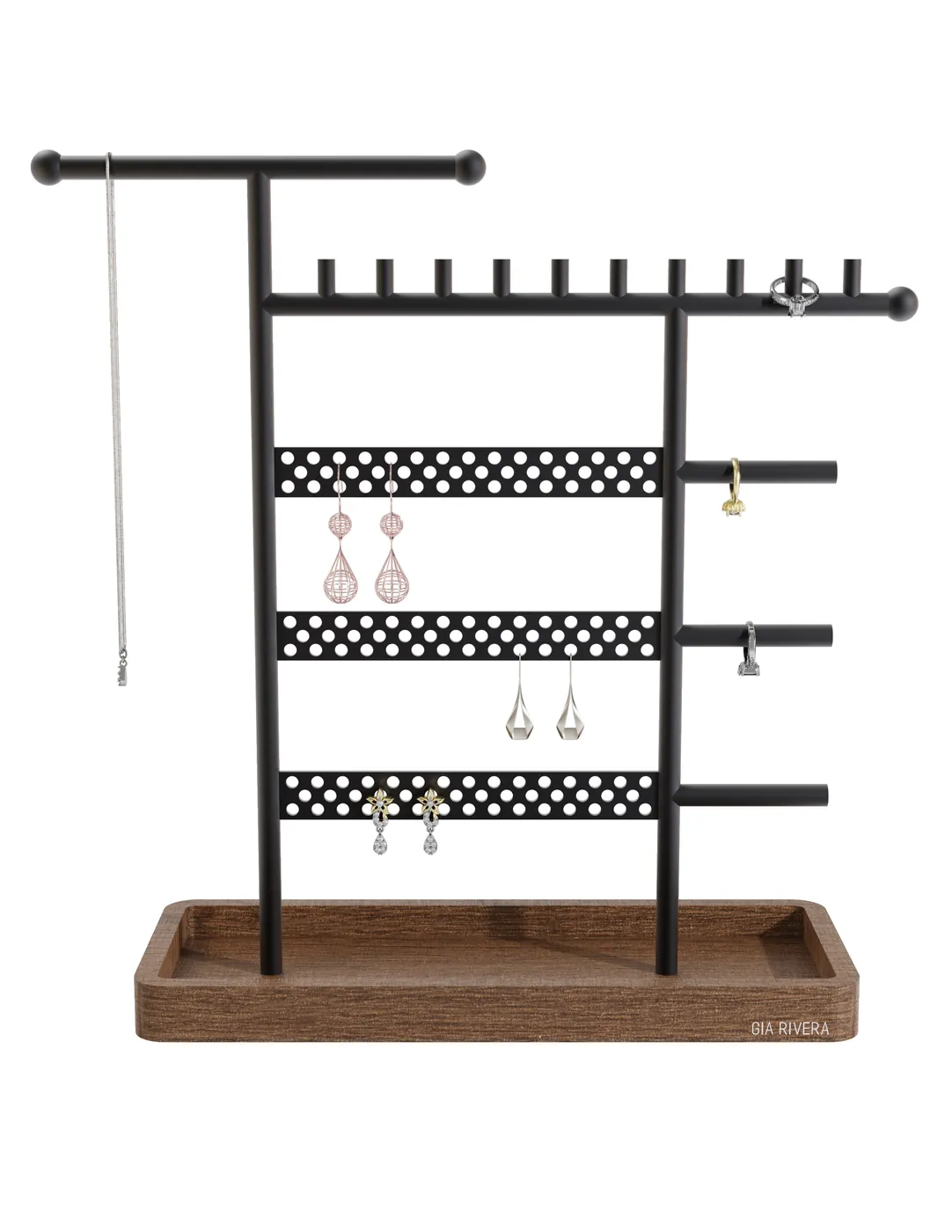 Front-on view of the matte black steel Gia Rivera jewellery stand, a T-bar top over perforated earring rails and side pegs, standing on a walnut-toned tray.