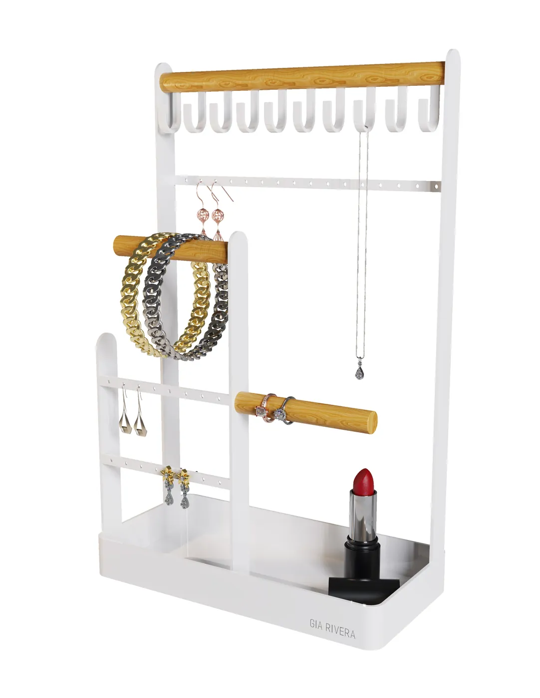 Oak and white lacquer Gia Rivera jewellery stand on a white studio background, hung with rose gold earrings, chain bracelets, a necklace and rings, a lipstick standing in the base tray.