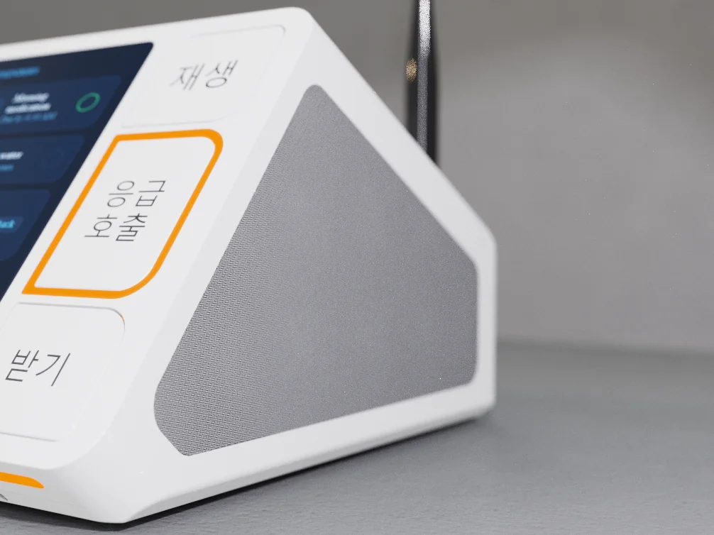 Close-up detail render of the Kira hub's Play, Emergency Call and Answer buttons, speaker grille and antenna